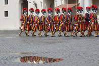 Vatican Swiss Guards wearing masks to curb the spread of COVID-19 march as they leave the St. Damaso courtyard after the visit of Spain's Prime Minister Pedro Sanchez to Pope Francis, at the Vatican, Saturday, Oct. 24, 2020. (AP Photo/Alessandra Tarantino)