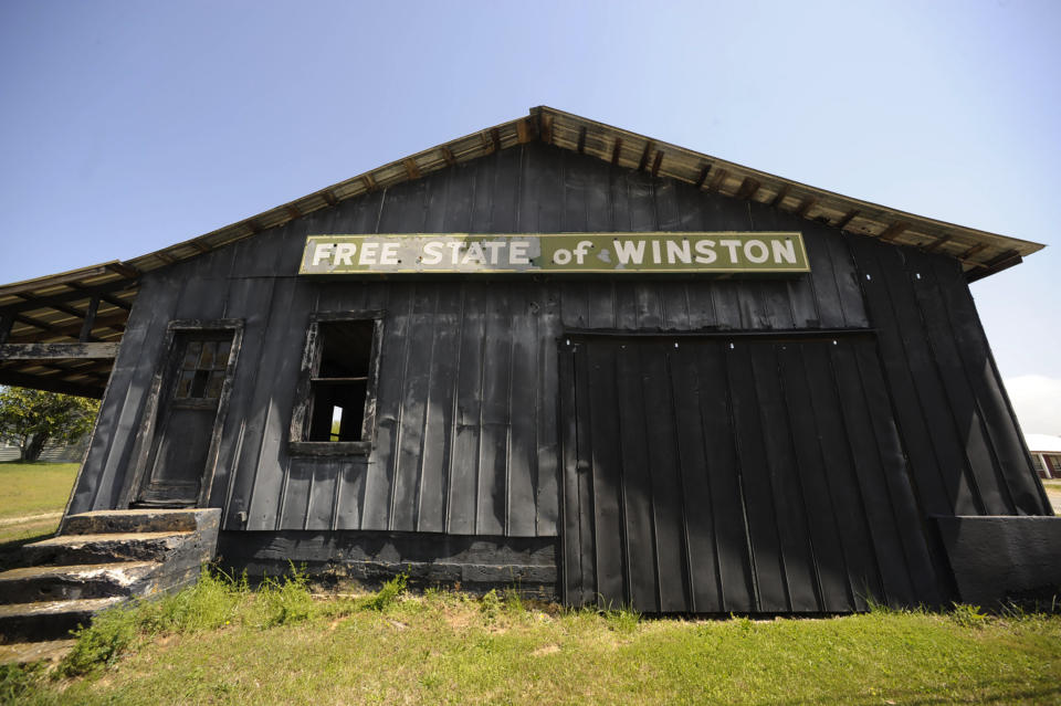 An abandoned building adorned with the age-old nickname of Winston County, stands near Double Springs, Ala., Monday, April 5, 2021. The county, which tried to secede from Alabama at the start of the Civil War, is trying to get more people immunized but running into problems with both supply and public willingness. (AP Photo/Jay Reeves)