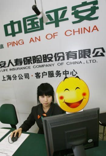 An employee of Ping An Insurance is seen working at the Shanghai Stock Exchange in 2007. Relatives of China's reformist premier have amassed huge riches during his tenure, according to a report in the New York Times that came as the Communist Party strives to clean house before a pivotal handover of power