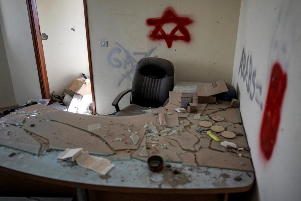 Graffiti left by Israeli forces inside a building in Khan Younis before Sunday’s troop withdrawal (Getty)