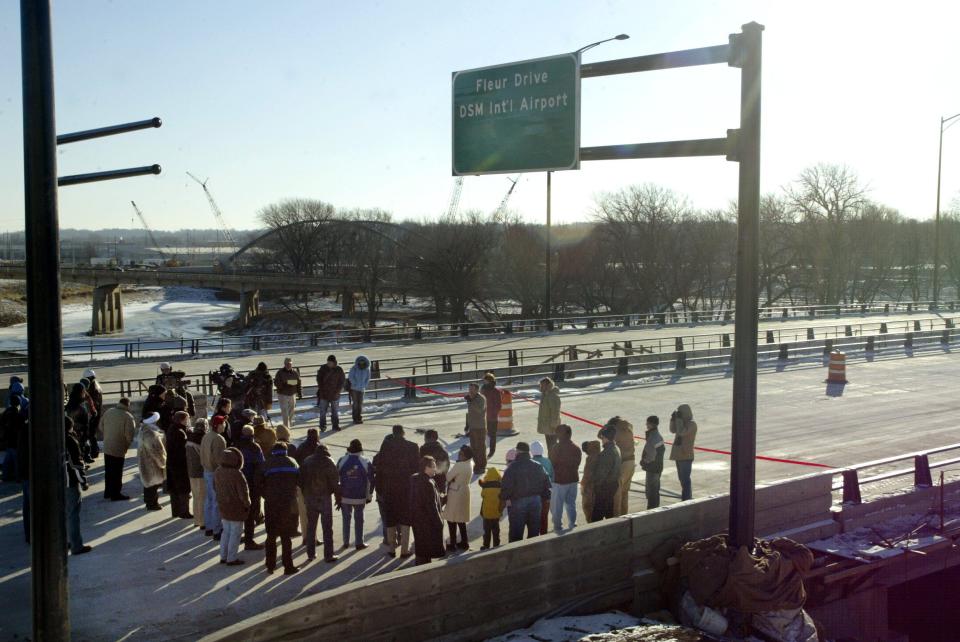 Residents brave single-digit temperatures to attend a ribbon-cutting ceremony to officially open the north-south leg of MLK from Ingersoll Avenue to Fleur Drive. "What a great day this is," said Des Moines Mayor Frank Cownie, pictured below at the ribbon-cutting.
