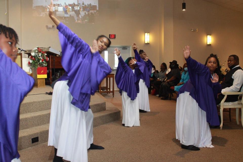 The First Missionary Baptist Church Youth Dance Ministry performs during the church's pastor's anniversary celebration service on Sunday.