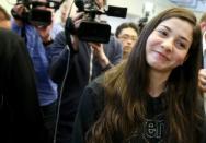 Syrian swimmer Yusra Mardini poses after a news conference in Berlin, Germany March 18, 2016. REUTERS/Fabrizio Bensch