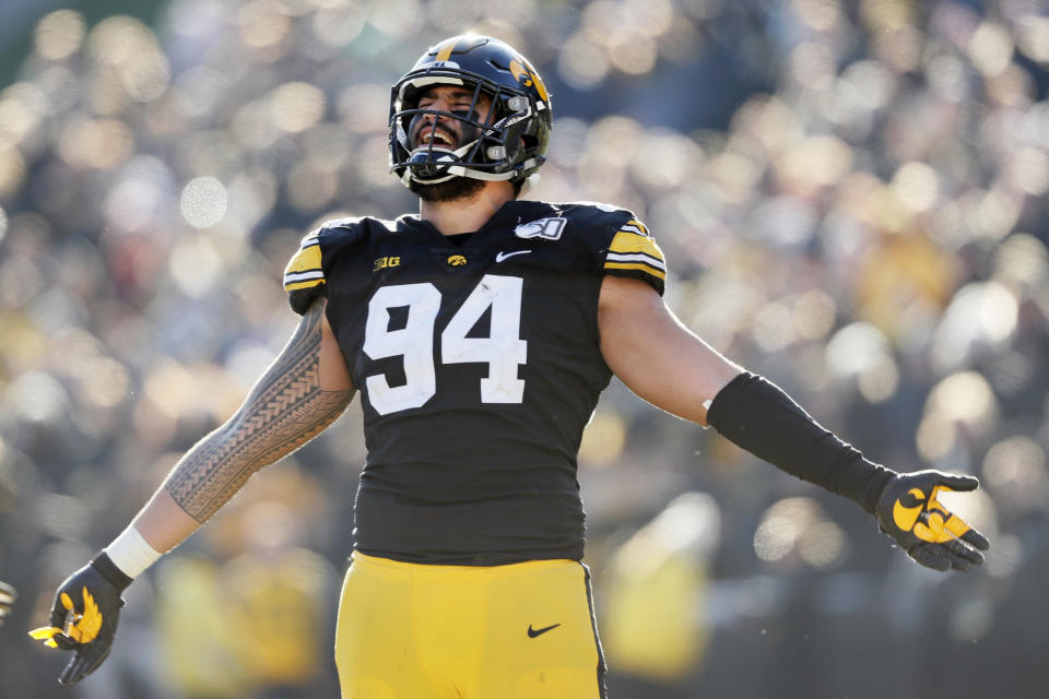 Iowa defensive end A.J. Epenesa celebrates during the second half of an NCAA college football game against Illinois, Saturday, Nov. 23, 2019, in Iowa City, Iowa. Iowa won 19-10. (AP Photo/Charlie Neibergall)