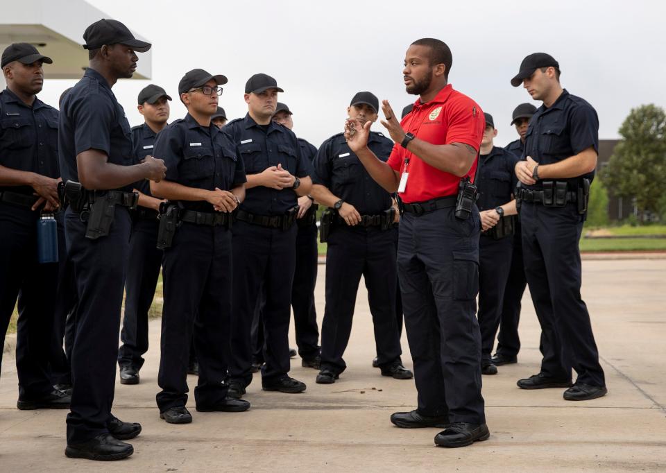 A training instructor, right, critiques a cadet after he made a practice traffic stop at the Roy Butler Austin Police Training Academy on August 20, 2021.
(Credit: Jay Janner/AMERICAN-STATESMAN/File)