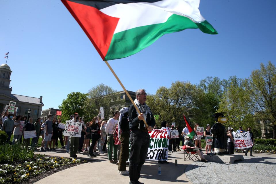 Students and community members gathered for a protest of the Israel-Hamas war Friday, May 3, 2024 on the Pentacrest in Iowa City, Iowa.