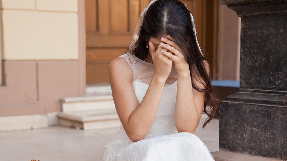 A bride cries on wedding day