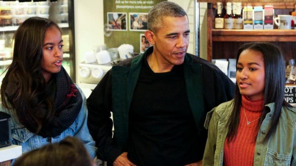 In this 2015 photo, President Barack Obama buys ice cream for his daughters Malia (right) and Sasha (left) at Pleasant Pops in Washington D.C. during Small Business Saturday. (Photo by Aude Guerrucci-Pool/Getty Images)