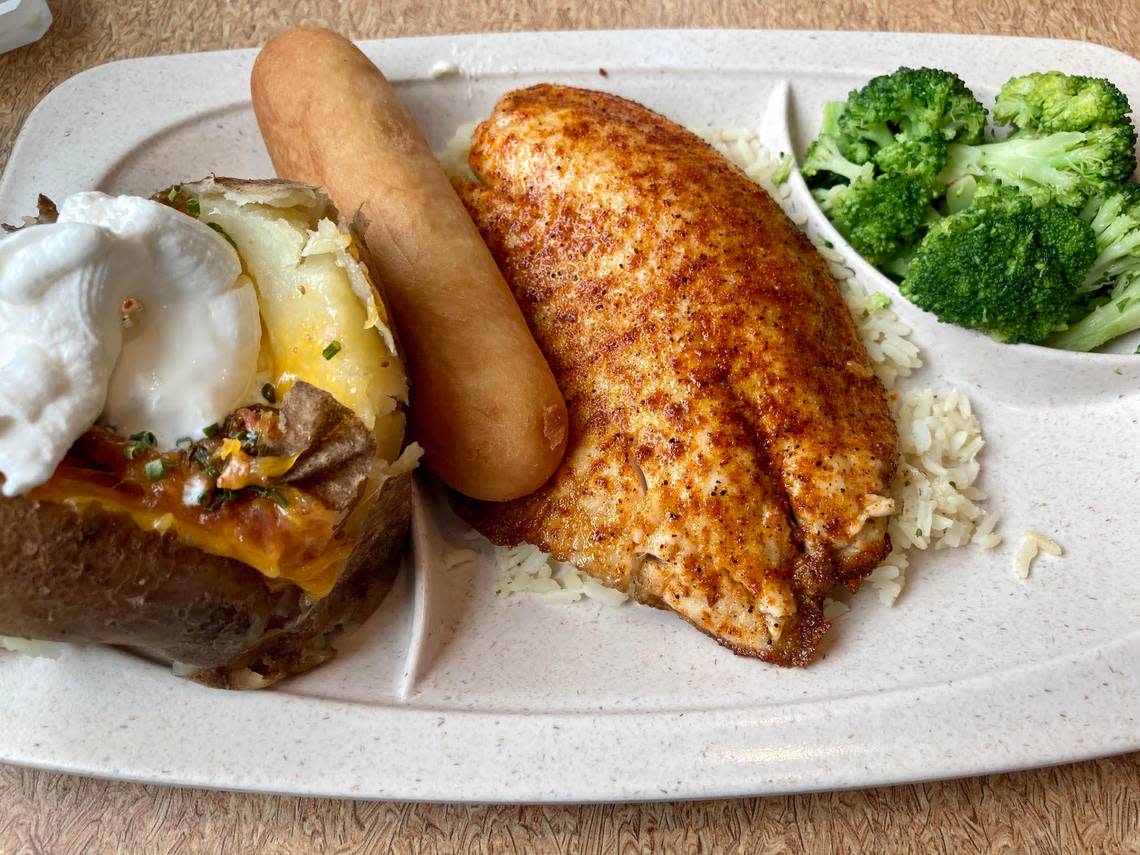 Blackened tilapia with a loaded baked potato, broccoli and a bread stick at the new Capt. D’s at 3004 Russell Parkway in Warner Robins.