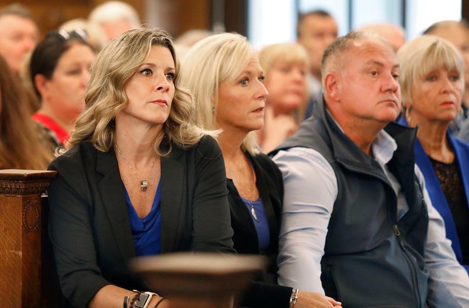 Cindy Chesna, the widow of Sgt. Michael Chesna, and family members watch as Emanuel Lopes is seated in court Thursday, June 8, 2023. Lopes is accused of murdering Weymouth police Sgt. Michael Chesna and Vera Adams in 2018.