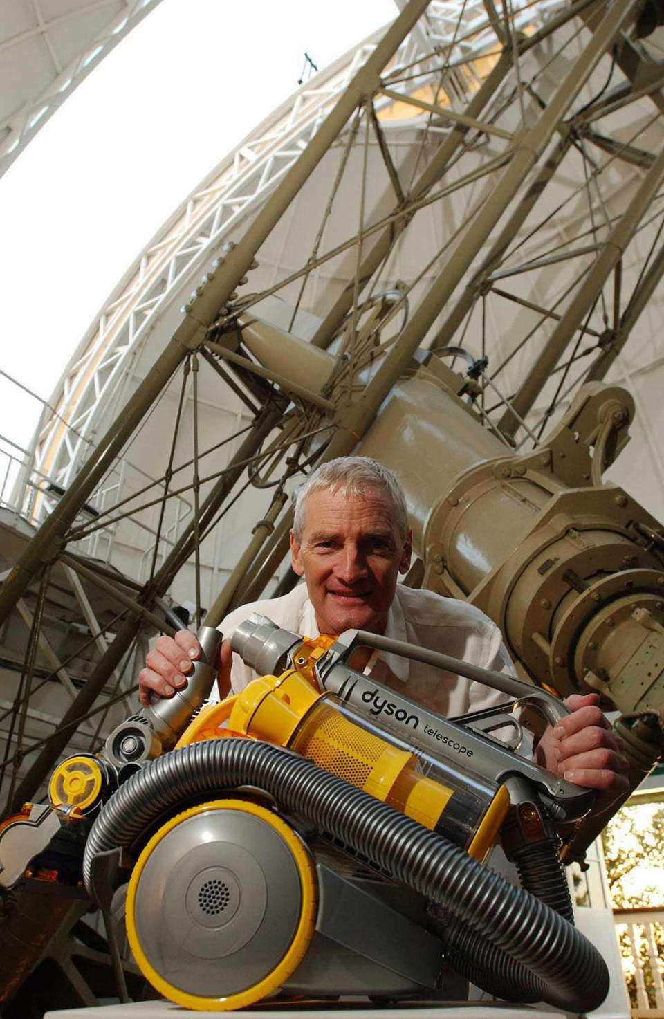 James Dyson with the new Telescope Dyson Cleaner, during a photocall for the new product inside the Royal Observatory, Greenwich, London.   *12/11/04: The boss of Dyson and his wife pocketed a  17 million bonus last year after shifting production of the firm's distinctive vacuum cleaners overseas, the company confirmed.