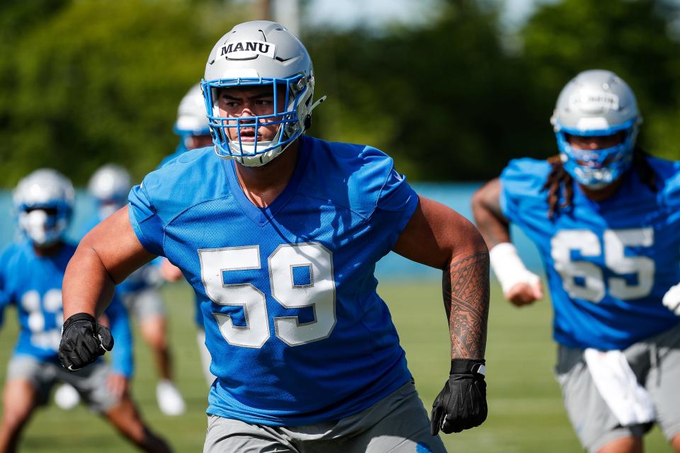 Detroit Lions offensive lineman Giovanni Manu (59) practices during rookie minicamp at Detroit Lions headquarters and practice facility in Allen Park on Friday, May 10, 2024.