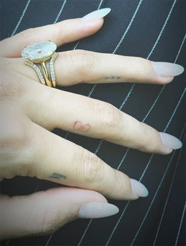 <p>Hailey Bieber Instagram</p> Hailey Bieber's wedding ring stack