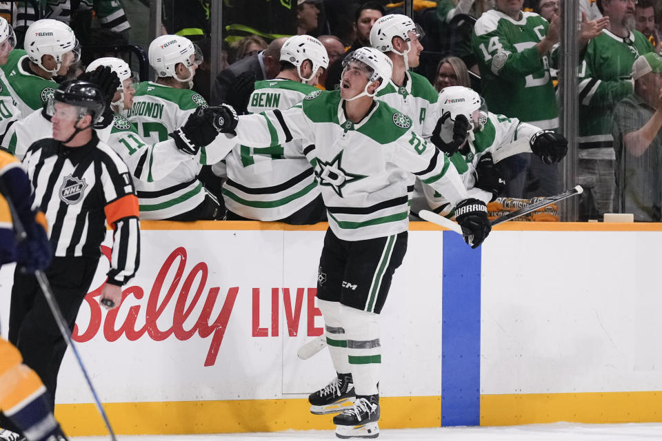 Dallas Stars left wing Mason Marchment (27) celebrates his goal with teammates during the second period of an NHL hockey game against the Nashville Predators, Thursday, Oct. 10, 2024, in Nashville, Tenn. (AP Photo/George Walker IV)