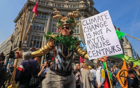 Activists blocked Oxford Street and other busy parts of London to highlight the threat of global warming - Credit: Amer Ghazzal/REX