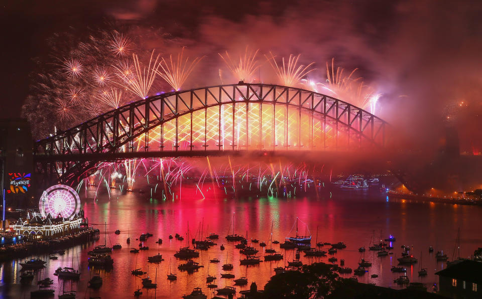 Fireworks explode from the Sydney Harbour Bridge and the Sydney Opera House during the midnight fireworks display on New Year's Eve on January 1, 2018 in Sydney, Australia. (Photo: Scott Barbour\City of Sydney via Getty Images)