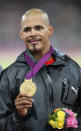 Gold medal-winning hurdler <a href="http://yhoo.it/Nhx3ML" rel="nofollow noopener" target="_blank" data-ylk="slk:Felix Sanchez;elm:context_link;itc:0;sec:content-canvas" class="link ">Felix Sanchez</a> of Dominican Republic has both Spanish and African-Dominican heritage. (Photo by Clive Brunskill/Getty Images)