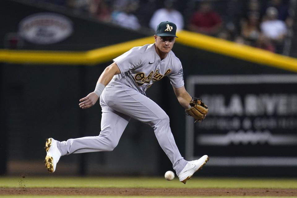 Oakland Athletics third baseman Matt Chapman chases down a grounder hit by Arizona Diamondbacks' Tim Locastro before throwing to second base for a force out during the second inning of a baseball game Tuesday, April 13, 2021, in Phoenix. (AP Photo/Ross D. Franklin)