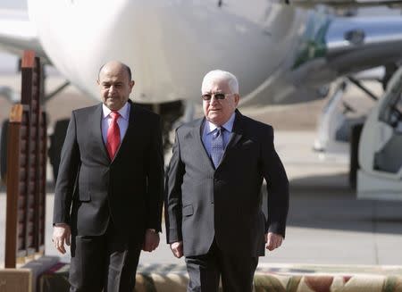 Iraq's President Fuad Masum (R) walks with Basra Governor Majid al-Nasrawi in Basra, southeast of Baghdad February 23, 2015. REUTERS/Essam Al-Sudani