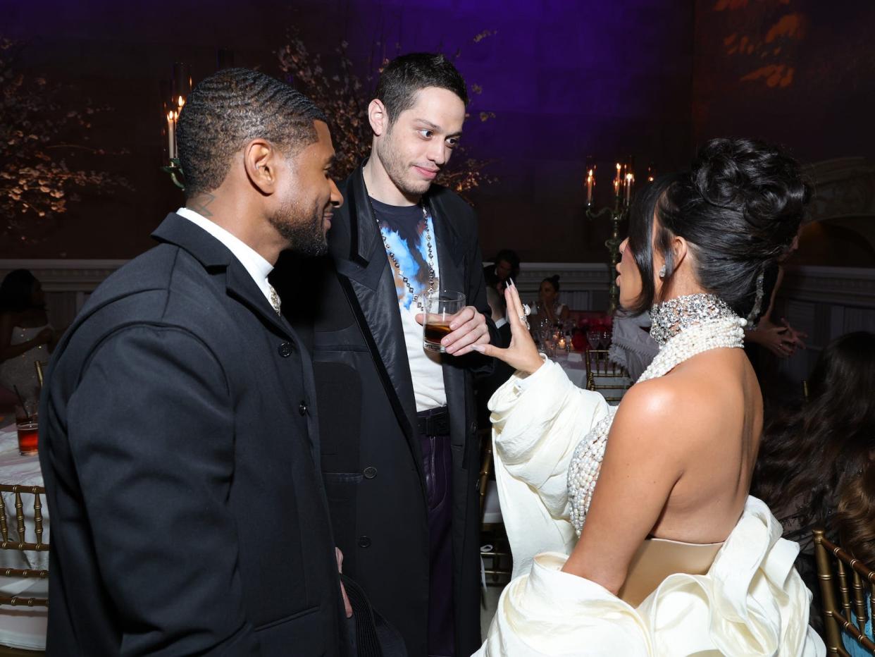 Usher, Pete Davidson, and Kim Kardashian speak at the 2023 Met Gala.