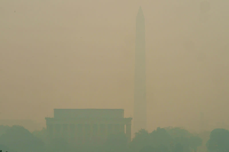 Washington, D.C., is seen through the haze from the Iwo Jima Memorial in Arlington, Va., on June 8. The Air Quality Index in Washington, D.C., reached 308 as wildfire smoke from Canada continues to come down through the East Coast. (Greg Nash)