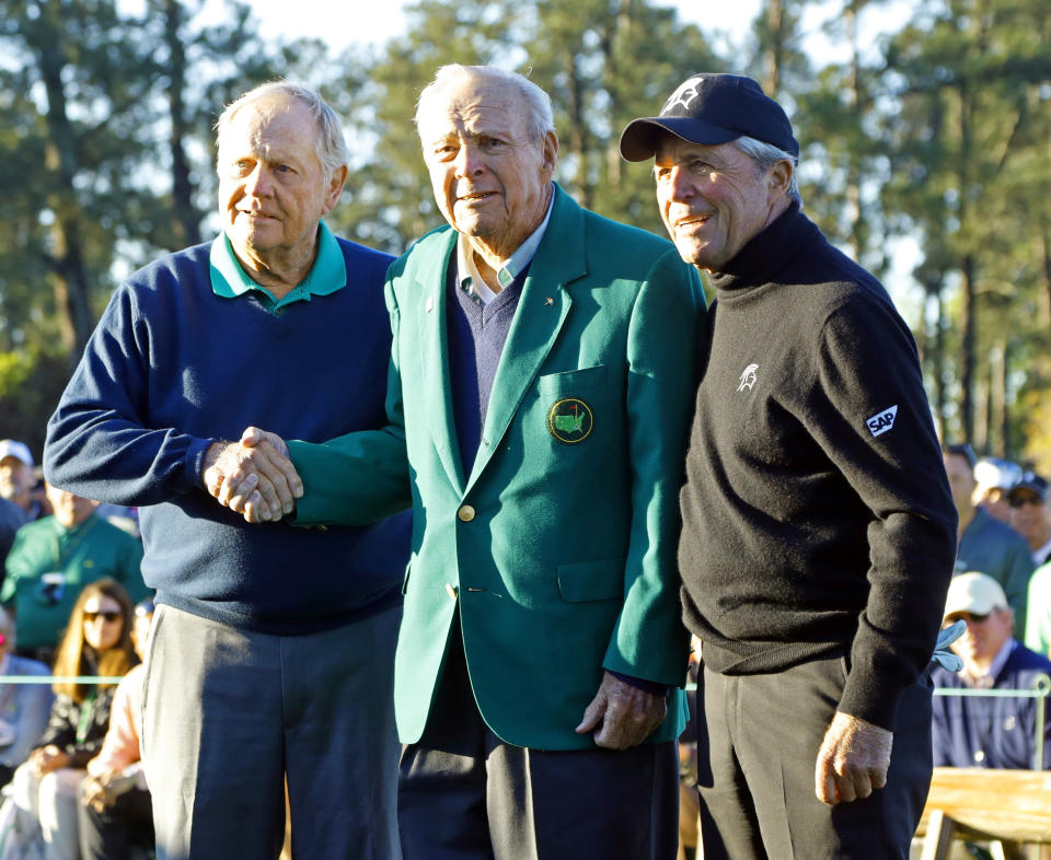 FILE - From left, Jack Nicklaus, Arnold Palmer and Gary Player stand together after the ceremonial first tee before the first round of the Masters golf tournament Thursday, April 7, 2016, in Augusta, Ga. Richard Globensky, a former warehouse assistant for the Augusta National Golf Club in Georgia, pleaded guilty Wednesday, May 15, 2024, to transporting millions of dollars worth of stolen Masters tournament memorabilia and historic items including a green jacket belonging to Arnold Palmer. (AP Photo/Charlie Riedel, File)