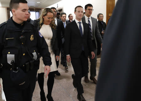 Facebook CEO Mark Zuckerberg walks to a meeting with Senator John Thune (R-SD) on Capitol Hill in Washington, U.S., April 9, 2018. REUTERS/Leah Millis