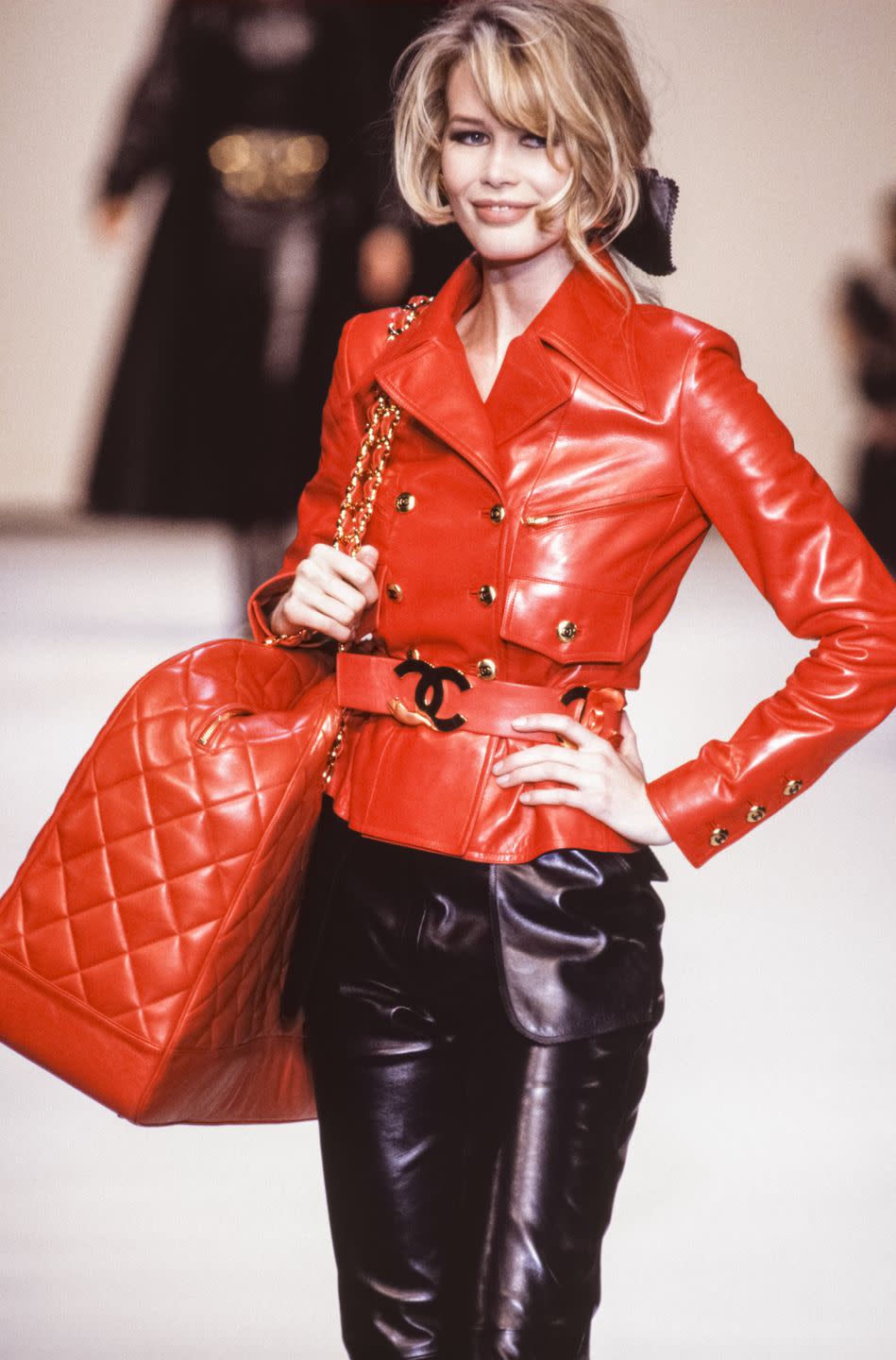 <p>"Here I'm wearing a leather double-breasted belted jacket with matching oversized shoulder bag and black leather trousers for the Chanel A/W 1992 catwalk show. I wore the same outfit for the A/W campaign shot by Karl and again at the end of last year the same full look for the January 2020 issue of Vogue Russia. So, it’s an incredibly special outfit from the Chanel archive that’s very close to my heart. I first met Karl, four years before that, when I was 18 at a fitting in his studio in Paris on Rue Cambon. He had seen my UK Vogue cover by Herb Ritts and asked that I come in. Before I knew it, I was being fitted for his new collection and then the next day I found myself driving to Deauville to shoot my first Chanel campaign, photographed by Karl. I remember us bonding over the fact that we were the only two people full of energy at 3am in the morning. In his case, he was always full of energy; I was just always full of adrenaline loving every second of working with him."</p>