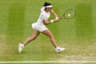Tunisia's Ons Jabeur returns to Aryna Sabalenka of Belarus in a women's singles semifinal match on day eleven of the Wimbledon tennis championships in London, Thursday, July 13, 2023. (AP Photo/Kirsty Wigglesworth)