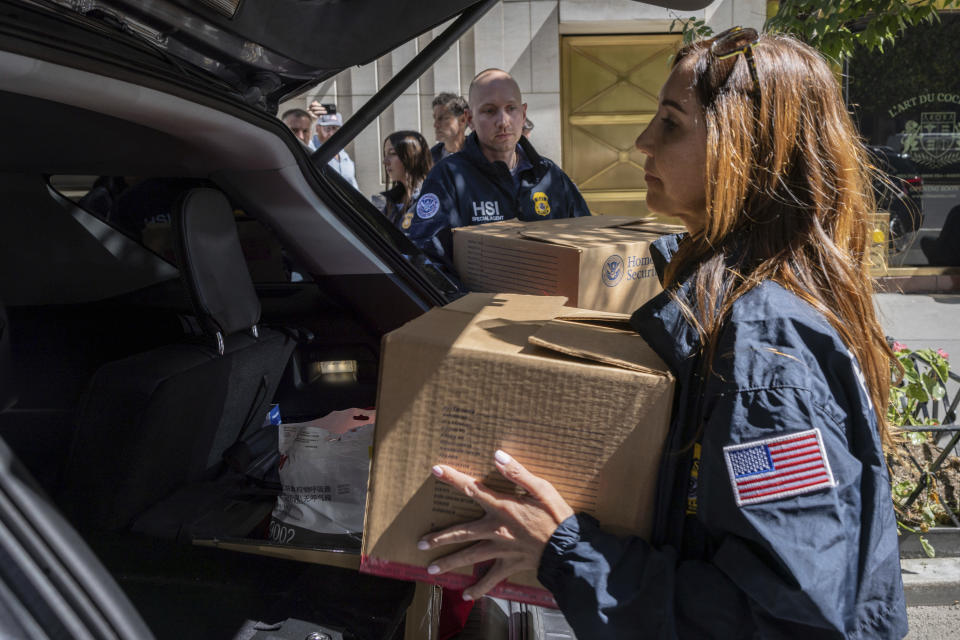 Federal agents put evidence boxes into a car outside a Park Avenue high-rise on Thursday, Sep. 1, 2022, in New York. FBI agents and Homeland Security Investigations personnel searched properties linked to Viktor Vekselberg, a close ally of Russian President Vladimir Putin. U.S. federal agents on Thursday simultaneously searched properties in Manhattan, the posh beach community of Southampton, N.Y., and on an exclusive Miami island that have been linked to the billionaire Russian oligarch whose $120 million yacht was seized in April. (AP Photo/Yuki Iwamura)