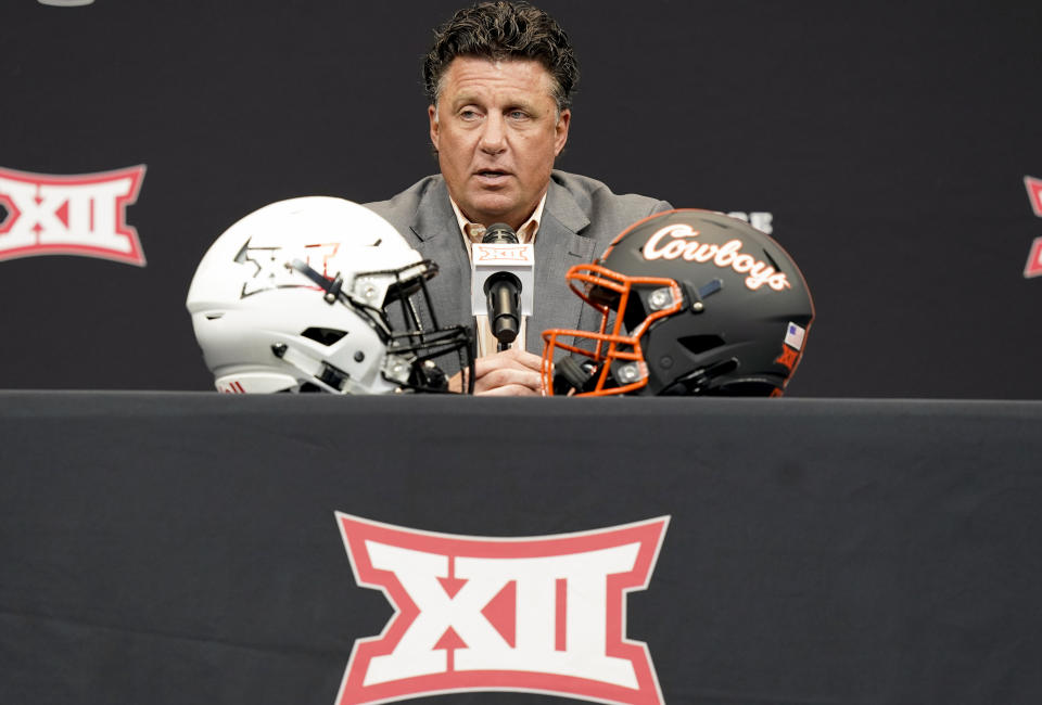 FILE - Oklahoma State head coach Mike Gundy answers a reporter's question at the NCAA college football Big 12 media days in Arlington, Texas, on July 13, 2022. The Big 12 is going into its 12th and final season as a 10-team conference. (AP Photo/LM Otero, File)
