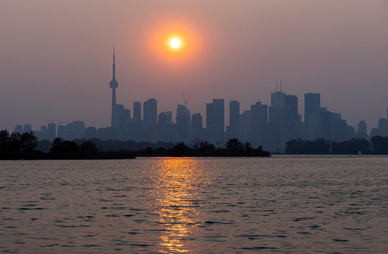 Wildfire smoke shrouds Toronto, Canada, on June 6, 2023. Environment Canada issued a special air quality statement for Toronto on Tuesday after the smoke from forest fires in Quebec and northeastern Ontario arrived in Toronto. Poor air quality may persist through most of this week. (Photo by Zou Zheng/Xinhua via Getty Images)