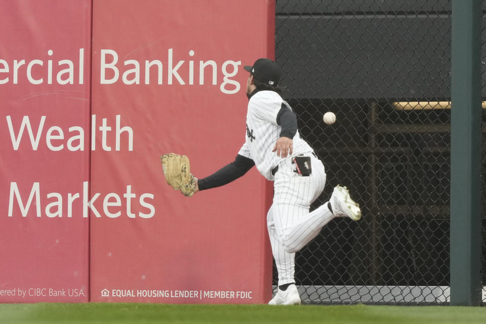 Chicago White Sox's Dominic Fletcher watches Atlanta Braves' Ozzie Albies' RBI double get past him during the sixth inning of a baseball game Monday, April 1, 2024, in Chicago. Ronald Acuna Jr. scored on the play. (AP Photo/Charles Rex Arbogast)