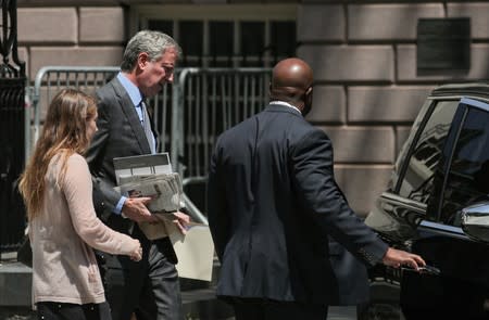 New York City Mayor Bill de Blasio exits City Hall in New York
