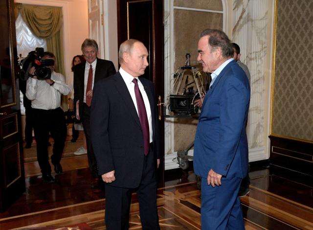 This photo taken on Wednesday, June 19, 2019, and distributed by Kremlin Press Service shows Russian President Vladimir Putin prior to an interview with American movie director Oliver Stone for his Revealing Ukraine documentary in the Kremlin in Moscow, Russia. (Alexei Druzhinin, Sputnik, Kremlin Pool Photo via AP)