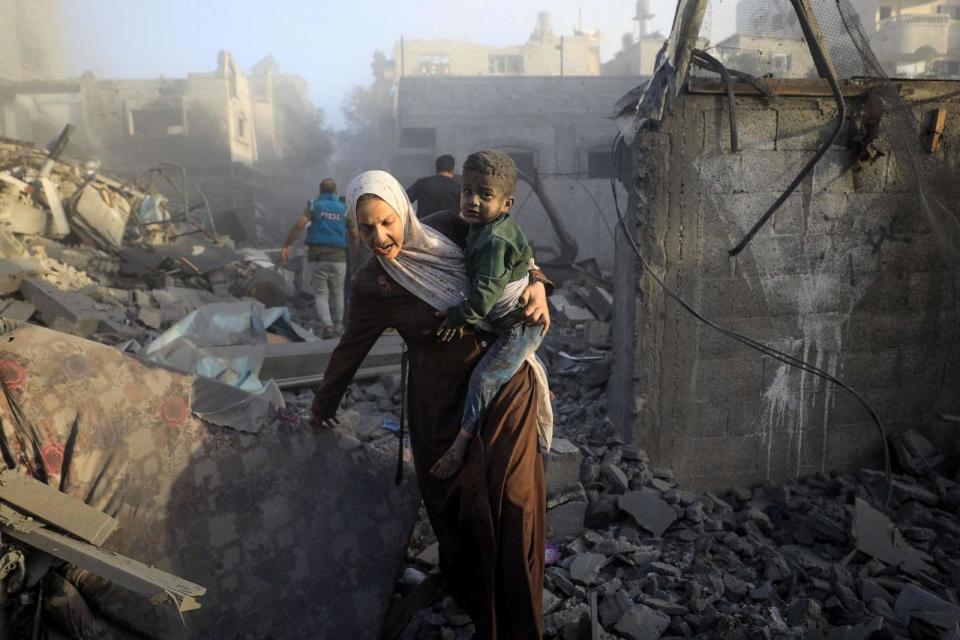 PHOTO: People flee following Israeli air strikes on a neighbourhood in the al-Maghazi refugee camp in the central Gaza Strip on Nov. 6, 2023, amid ongoing battles between Israel and the Palestinian Hamas movement. (Afp Contributor#afp/AFP via Getty Images)