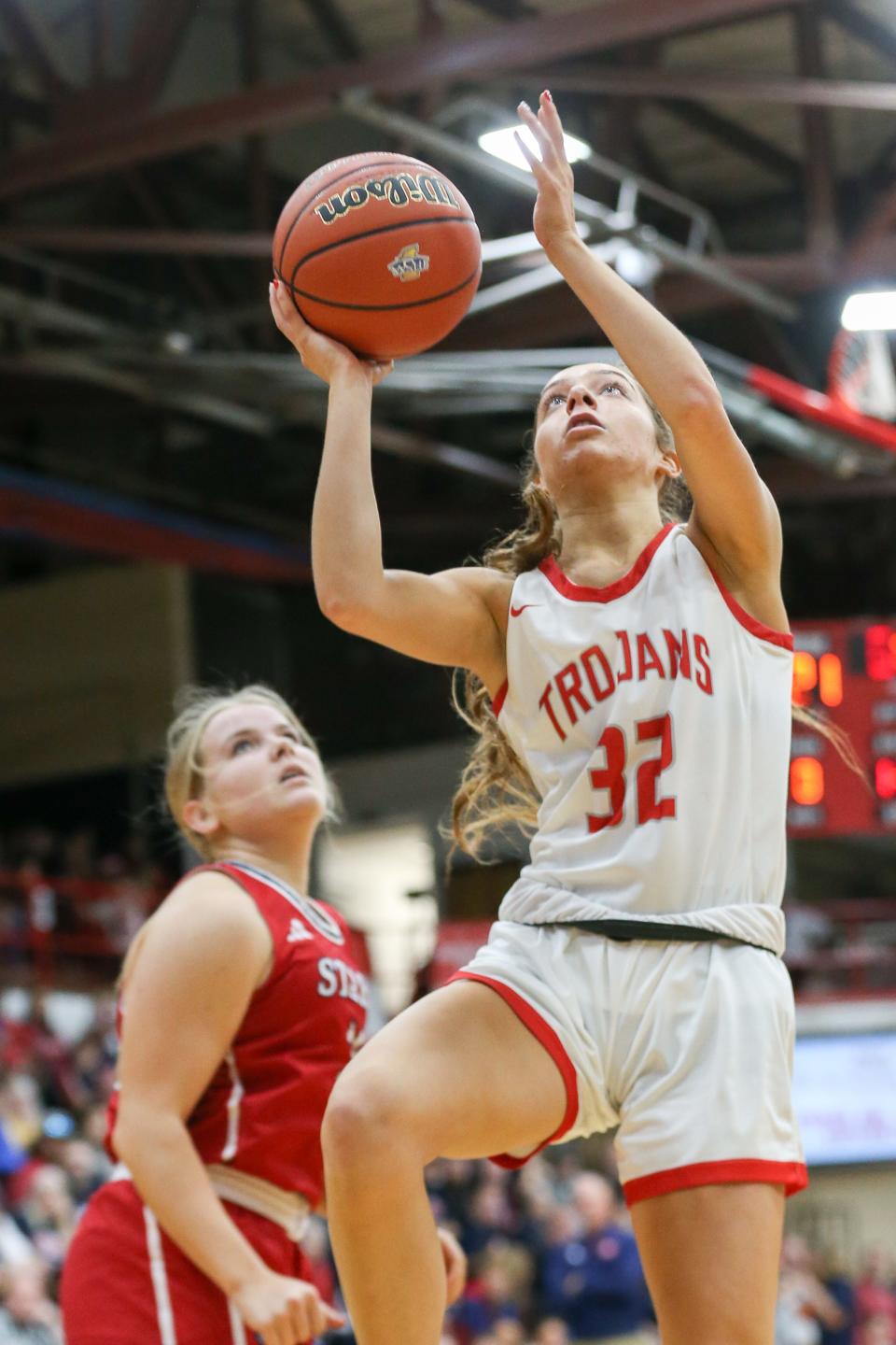 Center Grove Lilly Bischoff (32) goes in for a lay up as Bedford North Lawrence takes on Center Grove High School in the Girls Class 4A IHSAA Region 7 basketball championship, Feb 10, 2024; Bedford, IN, USA; at Bedford North Lawrence High School.