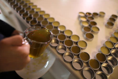 California "weed nun" Desiree Calderon, who goes by the name Sister Freya, pours CBD salve made from hemp at Sisters of the Valley near Merced, California, U.S., April 18, 2017. REUTERS/Lucy Nicholson