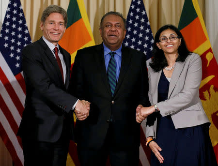 Nisha Biswal, U.S. assistant secretary of state for South and Central Asian Affairs (R) and Tom Malinowski, Central Asian Affairs and Assistant Secretary of State (L) shake hands with Sri Lanka's Minister of Foreign Affairs Mangala Samaraweera during their meeting in Colombo, Sri Lanka July 12, 2016. REUTERS/Dinuka Liyanawatte