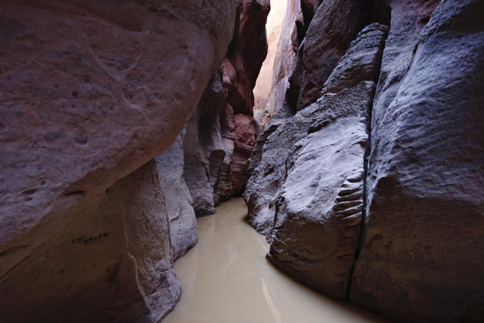 Water levels remain high days after a rainstorm in Buckskin Gulch in Kane County, Utah, on Sunday, Sept. 25, 2016. One man is dead and another is still missing after floodwaters poured into a slot canyon in southern Utah, endangering three groups of hikers who had to be hoisted out via helicopter Tuesday, March 14, 2023. The hikers were on a multi-day trek from Wire Pass to Lees Ferry through Buckskin Gulch's sandstone features that includes multiple narrow slot canyons (Lennie Mahler/The Salt Lake Tribune via AP)