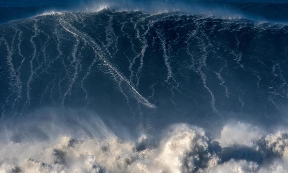 Riding the storm: Sebastian Steudtner surfs at Praia do Norte, Nazaré, 2018.