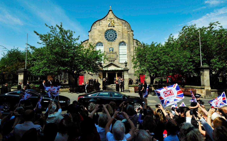 EDINBURGH, UNITED KINGDOM - JULY 30:  Guests arrive to the Royal wedding of Zara Phillips and Mike Tindall at Canongate Kirk on July 30, 2011 in Edinburgh, Scotland. The Queen's granddaughter Zara Phillips will marry England rugby player Mike Tindall today at Canongate Kirk. Many royals are expected to attend including the Duke and Duchess of Cambridge.     (Photo by Dylan Martinez - WPA Pool/Getty Images)