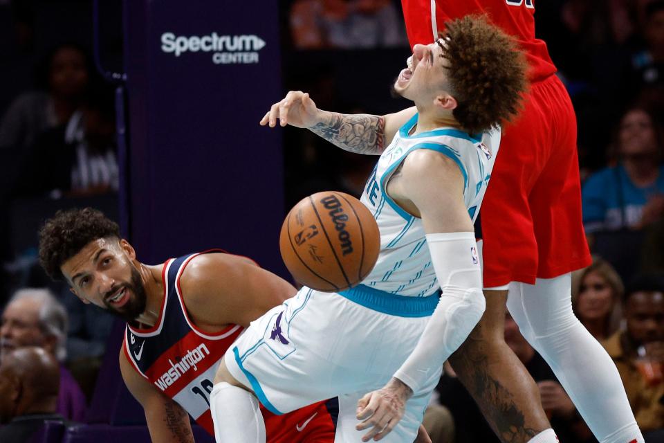 CHARLOTTE, NORTH CAROLINA - OCTOBER 10:  LaMelo Ball #1 of the Charlotte Hornets reacts as he is fouled and injured during the third quarter of the game against the Washington Wizards at Spectrum Center on October 10, 2022 in Charlotte, North Carolina. NOTE TO USER: User expressly acknowledges and agrees that, by downloading and or using this photograph, User is consenting to the terms and conditions of the Getty Images License Agreement. (Photo by Jared C. Tilton/Getty Images)