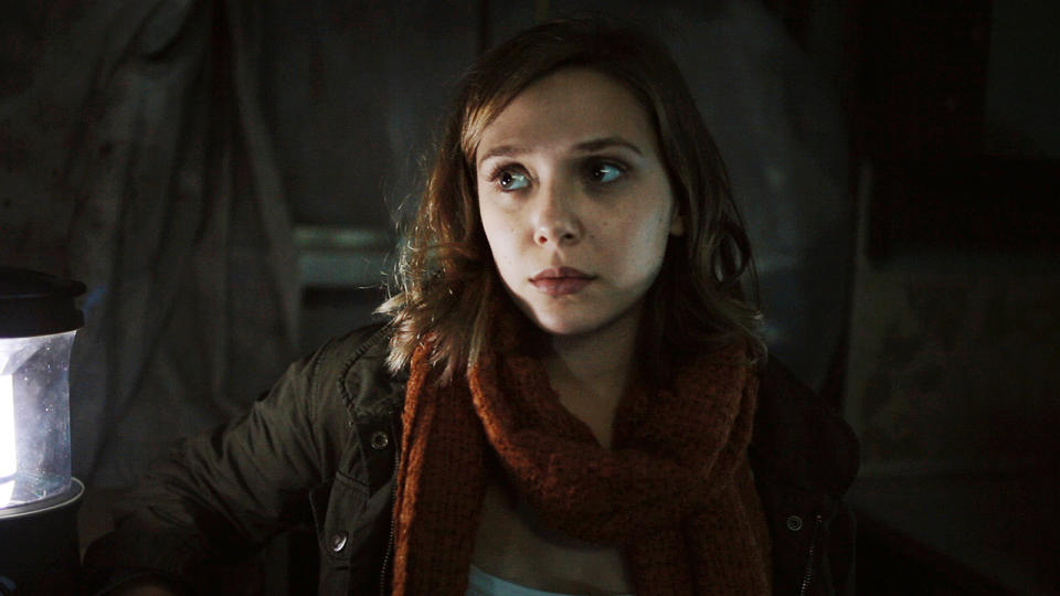 In this film image released by Open Road Films, Elizabeth Olsen is shown in a scene from