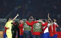 Chile players celebrate after defeating Peru in their Copa America 2015 semi-final soccer match at the National Stadium in Santiago, Chile, June 29, 2015. REUTERS/Marcos Brindicci