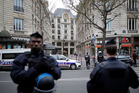 French police stand in front of the French financial prosecutor's offices following a bomb alert in central Paris, France, March 20, 2017. REUTERS/Benoit Tessier