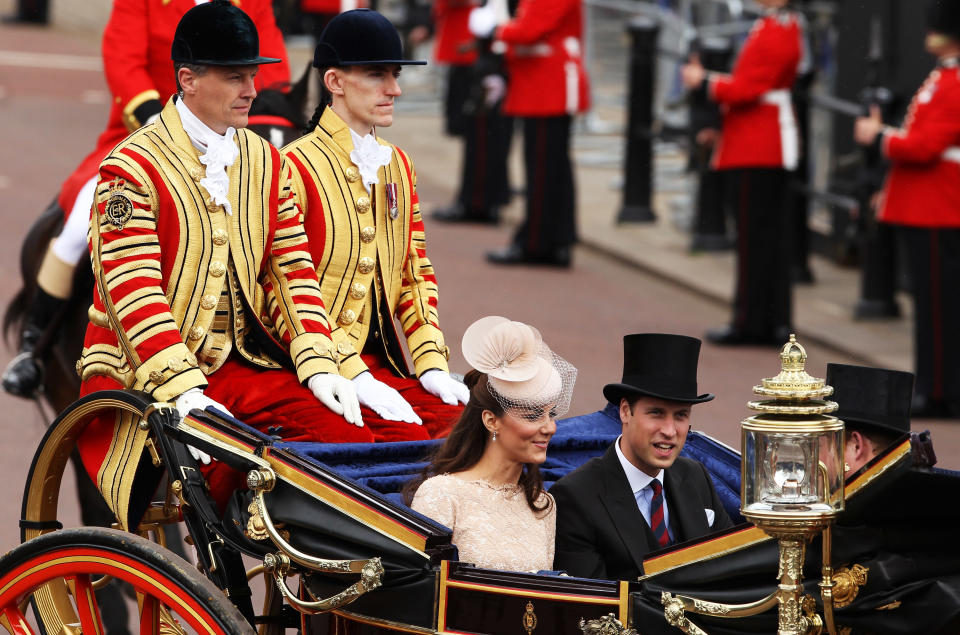 Echoing the Royal Wedding procession, the Duchess of Cambridge and Prince William are seen during the Diamond Jubilee royal carriage procession.
