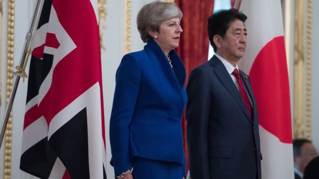 Japanese Prime Minister Shinzo Abe welcomes Theresa May to the Akasaka Guest House in Tokyo