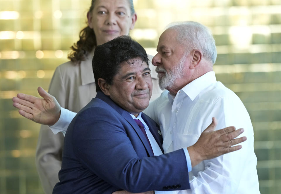 Brazil's President Luiz Inacio Lula da Silva, right, greets the President of the Brazilian Football Confederation Ednaldo Rodrigues, during the tour of the FIFA Women's World Cup trophy ahead of the Australia - New Zealand 2023 World Cup soccer tournament at Planalto palace in Brasilia, Brazil, Thursday, March 30, 2023. (AP Photo/Eraldo Peres)