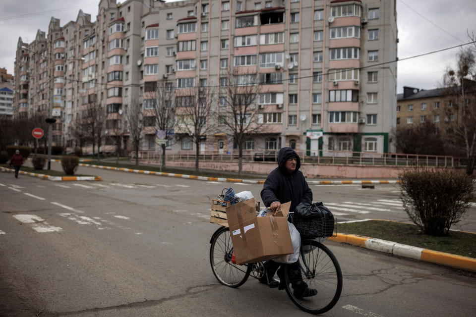 A man pushes his bicycle, amid Russia's invasion on Ukraine, in Bucha, in Kyiv region, Ukraine, April 6, 2022. REUTERS/Alkis Konstantinidis